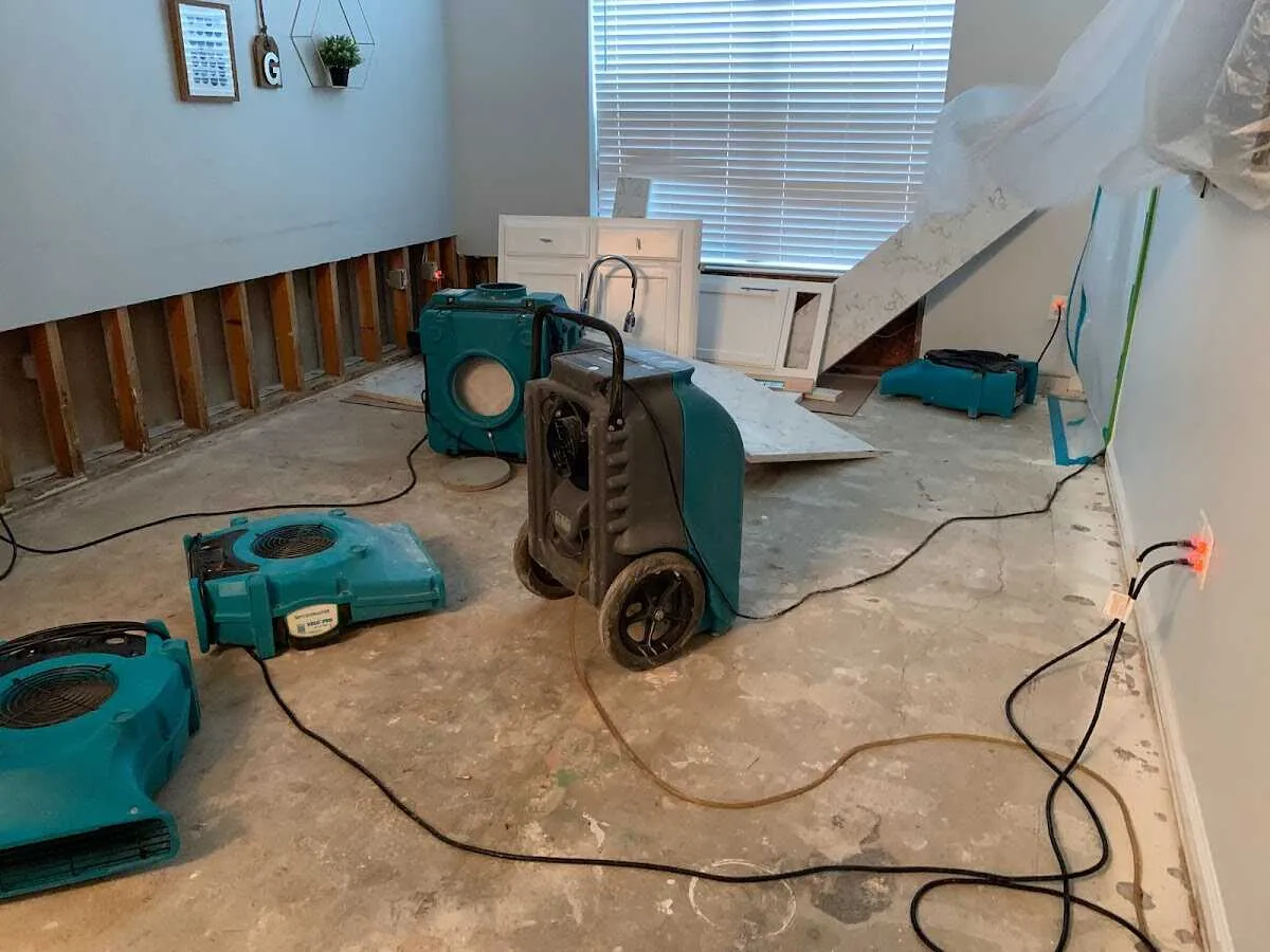 Dehumidifier in flood-cut room for Water Damage Restoration in Shorewood